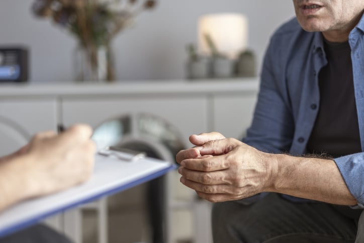 Middle-age man speaks with doctor about problems with low testosterone.