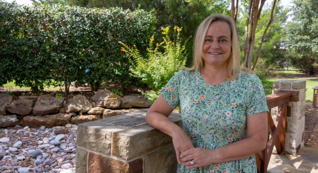 Rebecca Landreth poses outside her home in Richardson.