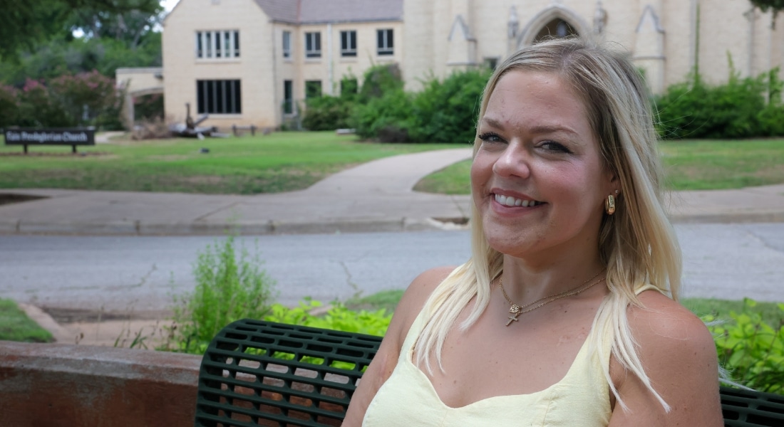 Transplant recipient sits on a bench across from a church in Wichita Falls.