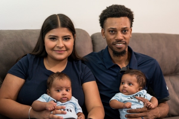 Maria Burns and her husband, Antonio, hold their twin babies Angel and Antonio Jr.