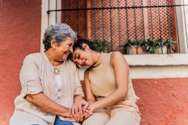 Grandmother and granddaughter together outdoors