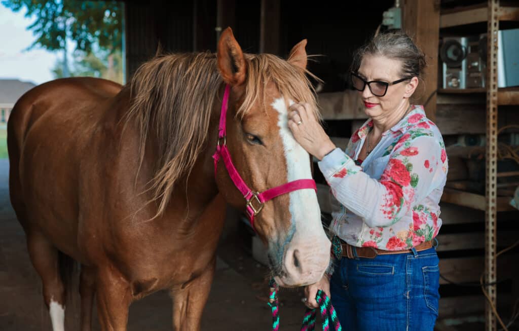 Amy Yoste with her mustang Holmes