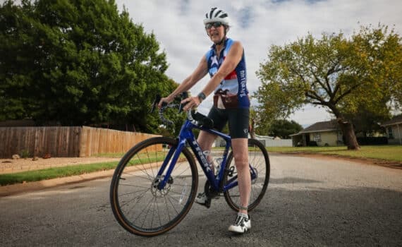 Cancer survivor sits on her bike near her home in Wichita Falls.
