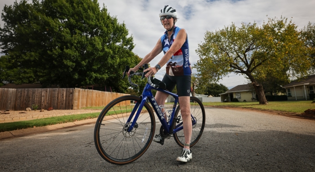 Cancer survivor sits on her bike near her home in Wichita Falls.