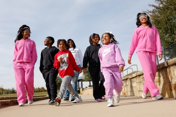 Jennifer Pulliam and her six children take a walk at a park near their Mansfield home.
