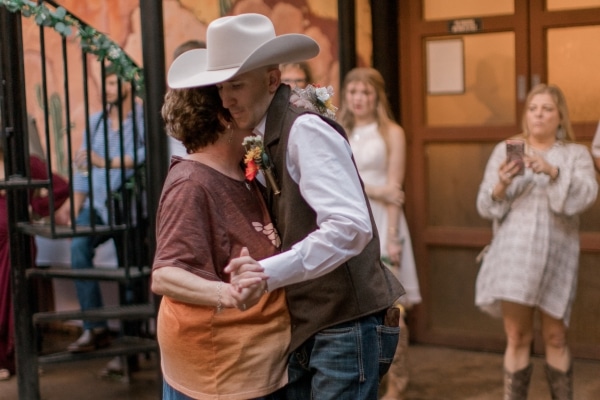 Kimberley Wynn dances with her son at his wedding.