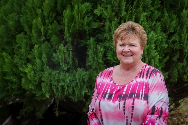 Kimberley Wynn poses outside her Rowlett home.