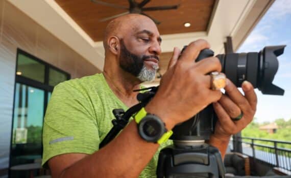Robert Flagg adjust his camera while shooting a North Texas landscape.