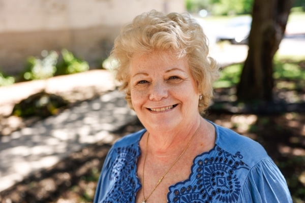 Heart attack survivor Laura Nowak poses outside First Methodist Church in Midlothian.