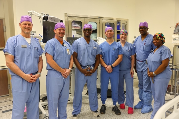 The orthopedic team at Methodist Midlothian stand in blue scrubs.