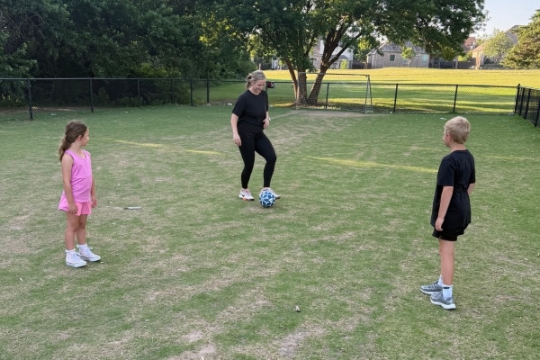 Kellianne Hodges plays soccer with her kids.