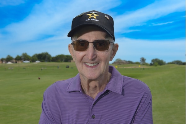 Tom Rider poses on the golf course in Denton.