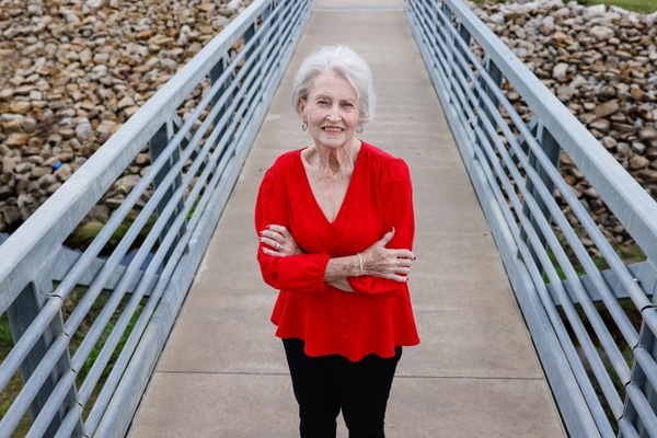 Transplant patient Linda Williams stands on a bridge at Grand Central Park in Grand Prairie.