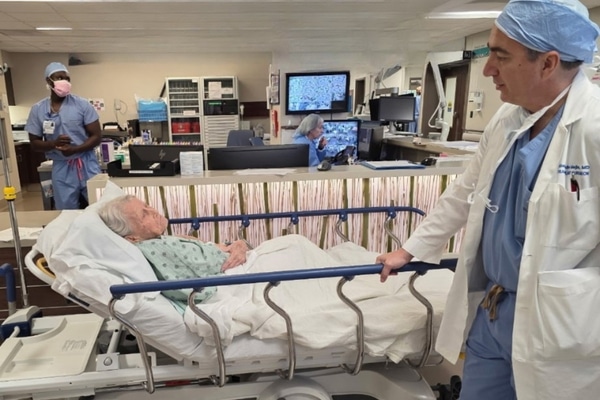 Linda Williams talks with her surgeon Alejandro Mejia before her liver transplant.