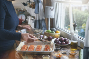 Preparing Spicy Salmon Bowl with Rice, Carrots, Cucumber and Avocado