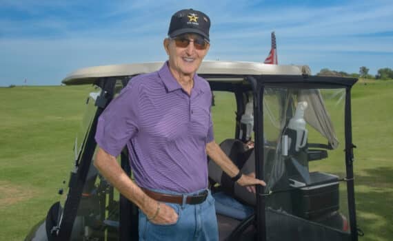 Thomas Rider serves as a marshal at the golf course.