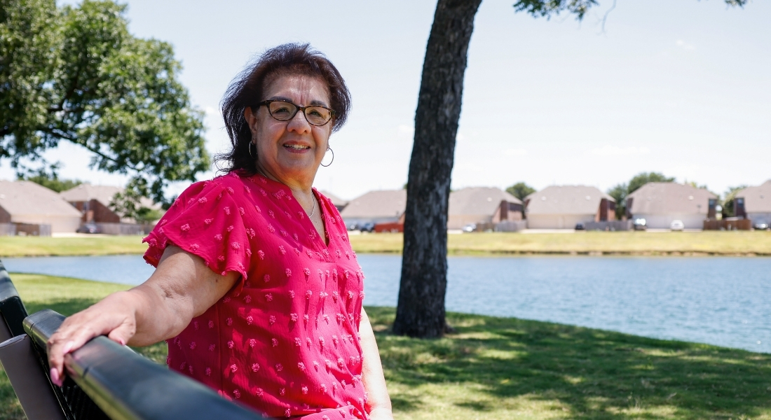 Lupe Macias sits on a bench at a park near her Cedar Hill home.