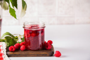 Homemade raspberry jam with fresh berries