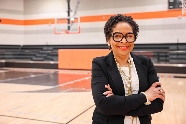Sharron Jackson stands on the basketball court at the school she used to lead as principal.