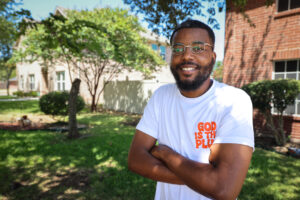 Ish Thorns stands outside his Cedar Hill home