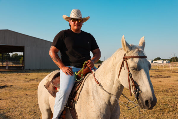 Caleb Deleon rides a horse in Ellis County.