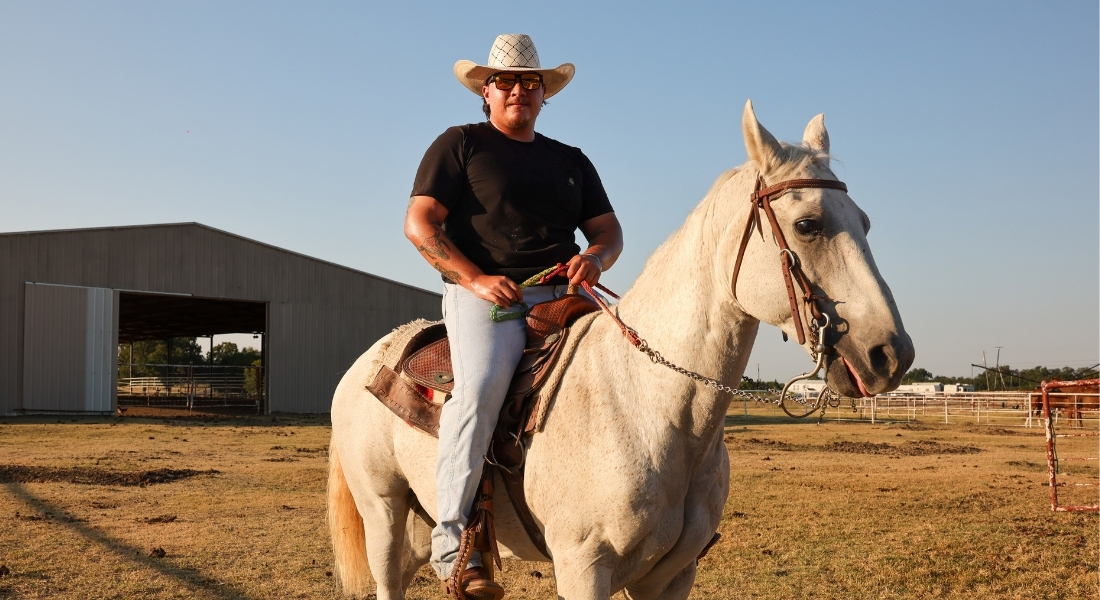Caleb Deleon rides a horse