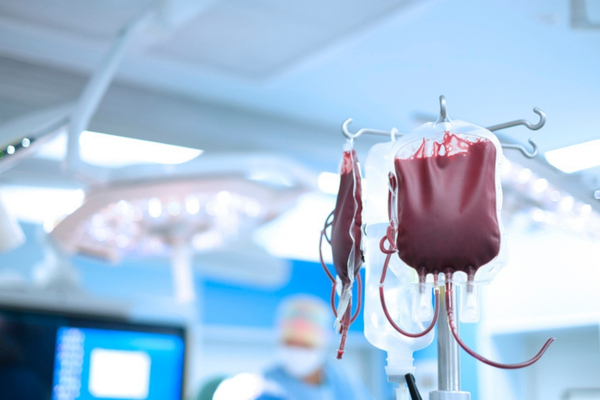 An IV bag full of blood in an operating room